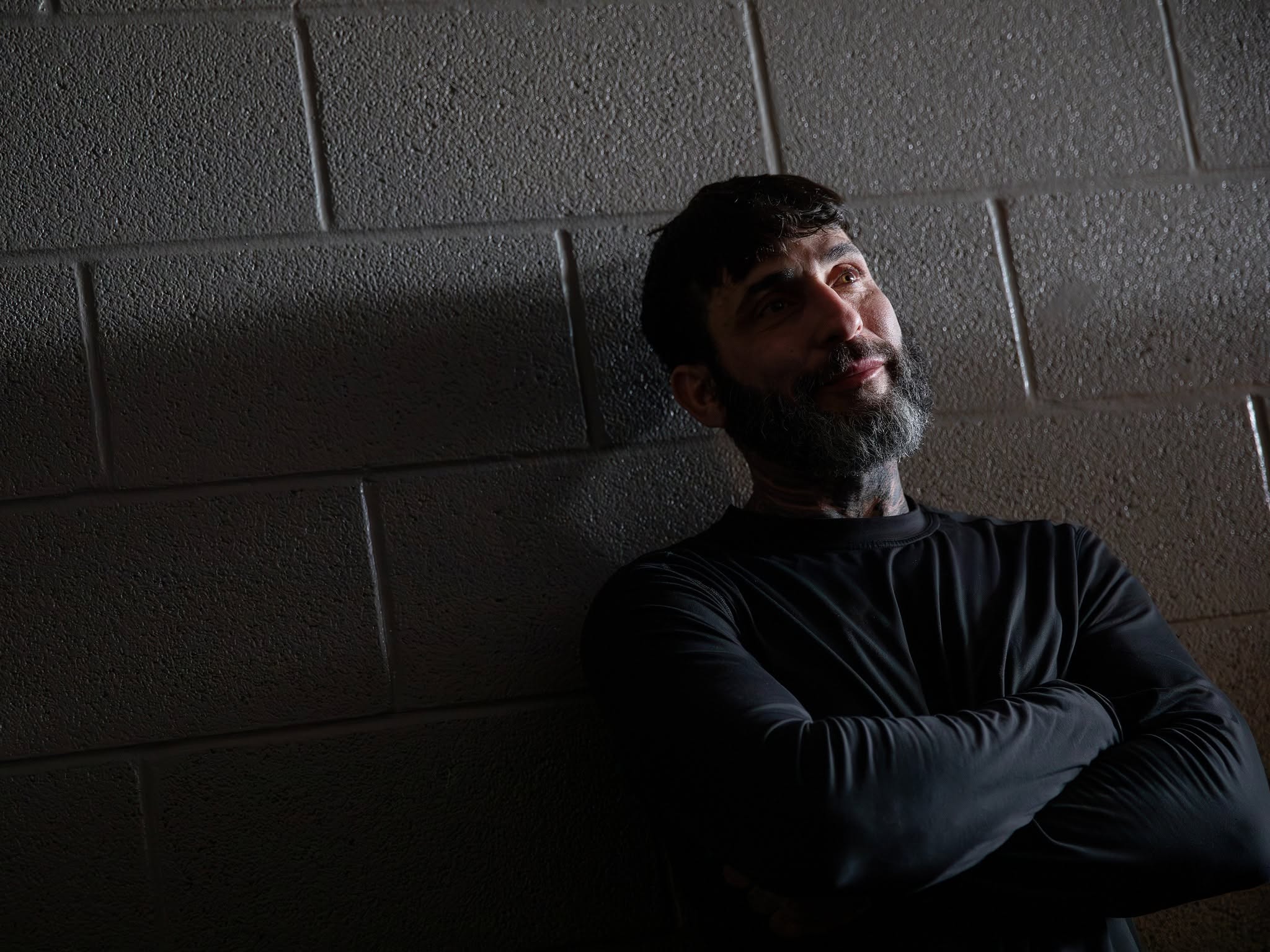 Man standing beside wall at Northwestern Regional Adult Detention Center.